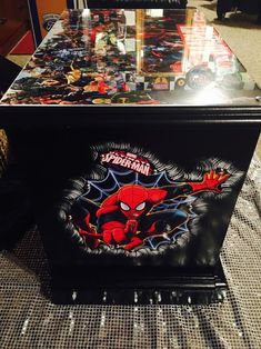 a toy chest sitting on top of a carpet covered floor