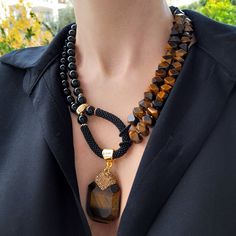 Chunky statement gemstone beaded necklace for women. Large tiger eye, onyx, handmade long necklace with big bead and natural stone. Big bold bohemian contemporary necklace in gold color are suitable for an casual look, evening look and for a holiday. These necklace will be a good christmas or birthday gift for mom, wife, girlfriend, sister or daughter. It emphasizes the beauty of your neck and adds charm to your look. FAST FREE SHIPPING https://www.etsy.com/shop/VesnekaBijou?ref=seller-platform- Tiger Eye Necklace, Large Bead Necklace, Necklace Mom, Contemporary Necklace, Tigers Eye Necklace, Pearl Necklace Set, Large Stone, Hippie Necklace, Gemstone Beaded Necklace