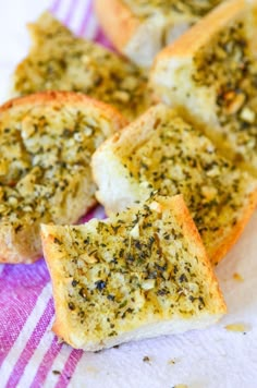 four pieces of garlic bread on a towel