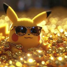 a pikachu doll wearing sunglasses sitting on some gold sparkles with lights in the background