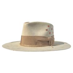 - Felt in western weight in Bone- 4.5" crown - 3.5" brim - Pinched crown - Entirely distressed with fire - 2" grosgrain band and bow + partial edge binding in Carmel - Multiple twine wraps in Natural - Embroidered starbursts in Brown + Orange + Mauve - Stitching detail on crown in Carmel- Natural tan leather sweatband- 100% silk interior lining- Sanded to perfection- No mass production, less waste, more love - This product is final sale + not eligible for returns or exchanges. Mass Production, Natural Tan, Heartland, Brown Orange, Twine, Tan Leather, Final Sale, Binding, Bones