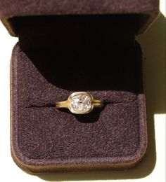 an engagement ring in a velvet box