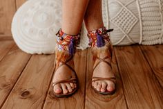 Elevate your summer footwear with our Stunning Purple and Orange Feather Fringe Sandal Ankle Ties. These flat shoe accessories feature decorative laces and leather sandal ankle wraps adorned with vibrant feather fringe. Perfect for adding a bohemian flair to your ensemble, they blend artisan craftsmanship with bold summer hues, making every step a statement of unique style and free-spirited elegance. * This ad is for a pair of anklets; footwear is not included. * If you need a custom design or f Summer Lace-up Closed Toe Sandals With Heel Strap, Summer Lace-up Sandals With Heel Strap And Closed Toe, Summer Closed Toe Lace-up Sandals With Heel Strap, Closed Toe Lace-up Sandals With Heel Strap For Summer, Spring Festival Lace-up Ankle Strap Sandals, Summer Vacation T-strap Sandals With Heel Strap, Summer Leather Heels With Tassels, Leather Summer Heels With Tassels, Summer Barefoot Sandals With Ankle Strap