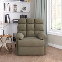 a living room with a recliner and bookshelf