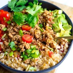 a bowl filled with rice, meat and veggies