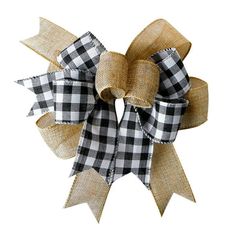 a black and white checkered bow with two large bows on the front of it