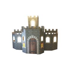 a paper model of a castle made out of construction materials, with doors and windows