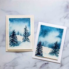 two cards with watercolor trees on them