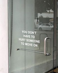 a sign on the glass door saying you don't have to hurt someone to move on