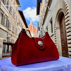 This bag has been made of the best genuine leather by local master crafters of Florence in Italy, designed for women who only accept premium Italian quality and luxury leather bags and modern Italian fashion. . . Sizes: Width: 32cm/ 12.6 inches Height: 20cm/ 8 inches Depth: 12cm/ 4.7 inches . . The story of this bag :  Introducing our exquisite Florence Leather Bag, a true embodiment of Italian craftsmanship and timeless elegance. Handcrafted with utmost care in the heart of Florence, Italy, this bag is a masterpiece that seamlessly combines style, functionality, and luxury. Imagine strolling through the charming streets of Florence, feeling the warm Mediterranean breeze against your skin. As you delve deeper into the city's rich history and artistic heritage, you can't help but notice the Italian Leather Evening Bag, Elegant Leather Bag As Gift, Elegant Leather Bag Gift, Elegant Leather Bag For Gift, Leather Clutch With Smooth Grain, Elegant Satchel With Leather Lining As Gift, Elegant Satchel With Leather Lining For Gift, Elegant Leather-lined Satchel For Gift, Italian Leather Bag As Gift