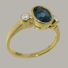 See website - kingsjewelery.com The center stone is approx 8x6mm oval and the two outer stones are approx 2.5mm round. We use two Cubic Zirconia and a large Natural Topaz which have been carefully chosen for this ring by expert jewelers to ensure a good fit. Modern Topaz Ring With Center Stone In Yellow Gold, Modern Yellow Gold Topaz Ring With Center Stone, Luxury Sapphire Topaz Ring With Center Stone, Fine Jewelry Gold Diamond Ring With Blue Topaz, Luxury 14k Gold Topaz Ring With Accent Stones, Fine Jewelry Topaz Ring With Bezel Setting, Fine Jewelry Yellow Gold Topaz Ring With Diamond Accents, Bezel Set Topaz Ring In Fine Jewelry Style, Modern Topaz Ring With Diamond Bezel Setting