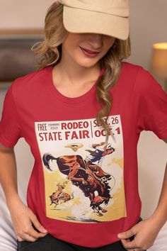 Vintage Rodeo Shirt - The Ultimate Country Music & Western Graphic Tee Saddle up with our Vintage Rodeo Shirt - the perfect blend of Western charm and modern comfort! Whether you're heading to the rodeo, hitting the trails, or just embracing your inner cowboy or cowgirl, this country music shirt is your new go-to favorite for any western adventure. How To Order  1. Review all photos carefully to see the design and available options. 2. Select your size and color from drop down choices or choose your custom color from the choices (see pic) 3. Click "Add to Cart". You can return to the listing to add more shirts if needed. 4. When you're ready, click "Proceed to Checkout". 5. During checkout, you can add a note to seller for any special requests or questions. About Our T-Shirts: Classic unis Fitted Graphic Tee For Fan Merchandise, Summer Fan Merchandise Front Print Tops, Summer Fan Merchandise Top With Front Print, Summer Fan Apparel Shirt With Screen Print, Retro Short Sleeve Shirt With Front Print, Crew Neck Shirt With Front Print For Concerts, Red Graphic Print Top For Concert, Summer Cotton Shirt For Fan Apparel, Fitted Short Sleeve Top For Fan Merchandise