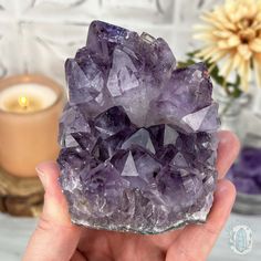 This mesmerizing Brazilian purple Amethyst is a true gemstone that boasts a rich violet hue accompanied by facets that sparkle in the light. The golden goethite inclusions within this gem create a unique, enchanting pattern. Approximate Size:L: 3.40" x W: 3.00" x H: 2.90"Approximate Weight:1.10 lbs. We make and carry many unique and one-of-a-kind items made of materials from around the world. Some may come with imperfections because they're natural. Appearances of cracks and chips aren't due to Faceted Amethyst Spiritual Gemstone, Mystical Purple Crystals With Natural Stones, Mystical Purple Natural Stone Crystals, Mystical Natural Purple Crystals, Lavender Gemstone Crystals For Spiritual Use, Lavender Healing Gemstone Crystals, Spiritual Lavender Gemstone Crystals, Spiritual Lavender Crystals, Purple Amethyst Gemstone Crystals