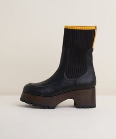 Loma Leather Chelsea Clog Boot With Ribbed Sock, Black Fall High Ankle Chelsea Boots With Rubber Heel Cap, Fall Ankle-high Platform Boots With Vibram Sole, Fall Boots With Vibram Sole, Fall Ankle-high Platform Boots With Rubber Heel Cap, Fall Heeled Boots With Vibram Sole, Fall Chelsea Boots With Rubber Heel Cap, Modern Platform Boots With Rubber Sole For Fall, Modern Boots With Vibram Sole For Fall, Modern Boots With Contrast Sole For Fall