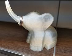 an elephant figurine sitting on top of a counter