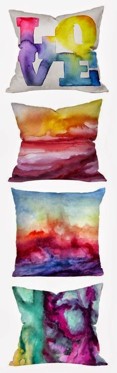 four pillows with the words love painted on them