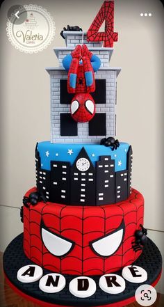 a spiderman themed birthday cake on a table