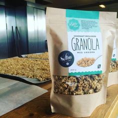 three bags of granola sitting on top of a counter