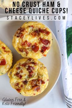 three muffins on a white plate with text overlay that says no crust ham & cheese quiche cups