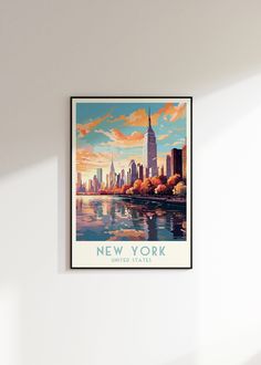 a poster hangs on the wall above a bed