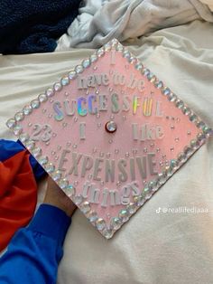 a pink graduation cap with the words i have to be successful and i like expensive times