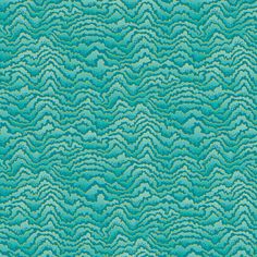 an abstract background with wavy lines in blue and teal green colors, including small waves on the surface