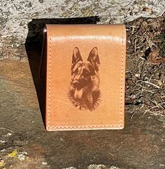 "This listing is for a beautiful handcrafted all leather money clip wallet. It features a top grain leather outer that has been laser engraved with a detailed German Shepherd design. The inside pockets and liner are made from a unique tan leather. It has a card pocket on each end and money clip for cash in the center. It measures approximately 4\" x 2 7/8. These money clip wallets make great gifts and will last for years. Please feel free to message me about custom engraving designs on these." Everyday Rectangular Card Holder With Engraved Logo, Leather Card Holder With Engraved Logo, Hand Tooled Leather Trifold Wallet As Gift, Engraving Designs, Leather Money Clip, Leather Money Clip Wallet, Leather Money Clips, Clip Wallet, Money Clip Wallet