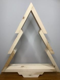 a wooden shelf with two triangles on it