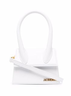 White leather Le Chiquito top-handle bag from JACQUEMUS featuring single circular top handle, gold-tone logo plaque, foldover top with magnetic fastening and adjustable detachable shoulder strap. This item is in size UNI and the color is White Le Chiquito Moyen, Jacquemus Bags, Jacquemus Le Chiquito, Jacquemus Bag, Top Handle Handbags, Woman Bags Handbags, Dolce & Gabbana, Metallic Logo, White Bag