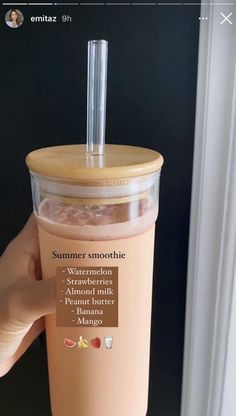 someone is holding up a cup with a straw in it that says summer smoothie