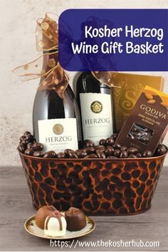 the kosher herzog wine gift basket includes two bottles of wine, chocolates and candies