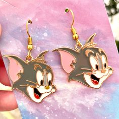 Tom & Jerry Cat Earrings For Sale! These Earrings Are Absolutely Adorable! They Are New, Have Never Been Worn, And Are Handmade! They Have Pierced Earring Loops With Cat Charms Hanging From Them. They Are About 2 Inches Tall, And 1 1/2 Inches Wide. Such Adorable And One Of A Kind Earrings To Add To Your Jewelry Collection! Tom Jerry, Cat Charm, Tom And Jerry, Cat Earrings, Earings Piercings, Jewelry Collection, Charms, Jewelry Earrings, Women Jewelry