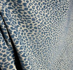 a blue and white animal print fabric