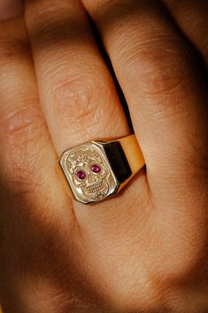 Product Details Ring Style: A custom, engraved signet ring featuring a Calavera, shown here in 14K gold, with two rubies for the eyes. It can be customized to feature just about any engraved design you can dream up. The ring top dimension is 14x12mm. Swap Your Stone: We have many stone options available to choose from, often at no additional cost or for a small upgrade cost! These include Salt and Pepper Diamond, Montana Sapphire, Turquoise, Moonstone, Lab-Created Alexandrite, and many more. Ple Engraved Signet Ring, Staghead Designs, Ring Guard, Engraved Design, Detailed Ring, Montana Sapphire, Unisex Ring, Ring Style, Salt And Pepper Diamond