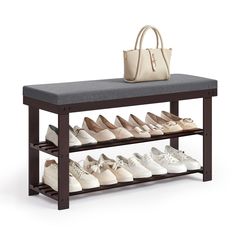 there is a bench with shoes on it and a handbag next to the shoe rack