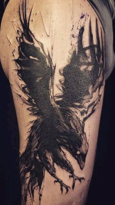 the back of a man's leg with black ink on it