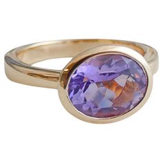 8x10mm Oval Faceted Amethyst is set in gold-plated 925 sterling silver. Available in sizes 6, 7, 8 and 9. Please let me know what size you want when you order. Purple Oval 14k Gold Gemstone, Gold Amethyst Oval Cabochon Jewelry, Gold Amethyst Cabochon Ring, Yellow Gold Amethyst Cabochon Ring, Luxury Formal Amethyst Ring, Oval Cabochon, Gold Plated Sterling Silver, Cocktail Rings, Sterling Silver Rings, Gold Plate