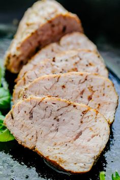 slices of meat sitting on top of lettuce