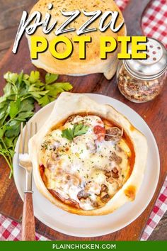 pizza pot pie is sitting on a plate with a fork and knife next to it