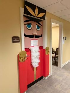 a door decorated with a cardboard nutcracker