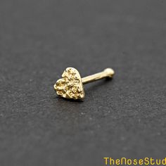 3.5mm Tiny Nugget Heart 14K Solid Gold Nose Bone Ball End Stud Metal: Solid 14K Yellow Gold Metal Stamp: 14K Finish: Polished Disc Size: 3.5mm Thickness: 0.6mm / 22 Gauge Post Length: 6mm Backing: Ball End Stud *Nickel FREE* It comes with a gift box. Ready for gifting Please read our shop policy before placing your order Thank you for visiting our shop Nose Piercing Unique, Nostril Stud, Stud Nose Piercing, Gold Nugget Jewelry, Nose Bone Stud, Xoxo Jewelry, Ysl Necklace, Nose Piercing Ring, Crystal Jewelry Necklaces