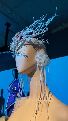 a mannequin with jellyfish in its hair