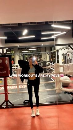 a woman taking a selfie in front of a mirror with the words life workouts army wives on it