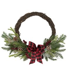 a christmas wreath with pine cones, evergreen leaves and red plaid bow hanging on a white wall