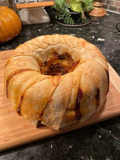 a bundt cake sitting on top of a wooden cutting board