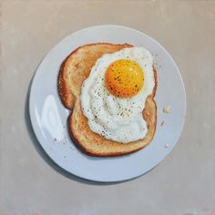 an egg and toast on a white plate