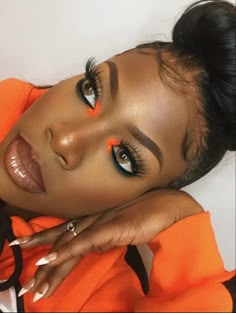 Black Women Orange Makeup, Makeup Looks For Orange Outfit, Orange And Blue Makeup Looks Black Women, Orange Black Eye Makeup, Colorful Makeup Looks Black Women, Orange Inner Corner Makeup, Orange Rhinestone Makeup, Orange Dress Outfit Black Women, Brown And Orange Makeup Looks