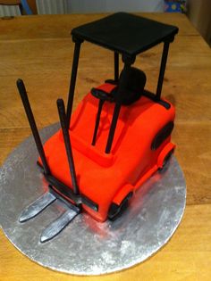 a cake shaped to look like a fork lifter