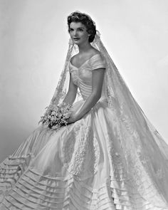 an old photo of a woman in a wedding dress