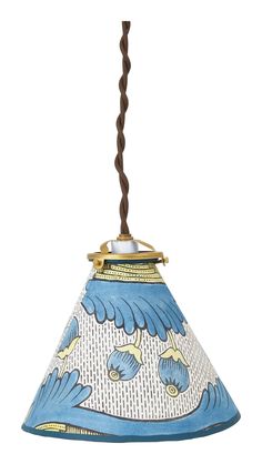 a blue and white lamp hanging from a ceiling fixture with a brown cord attached to it